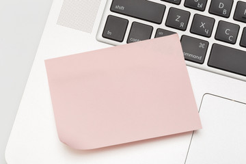 Sticky note on laptop with copy space. For all concept