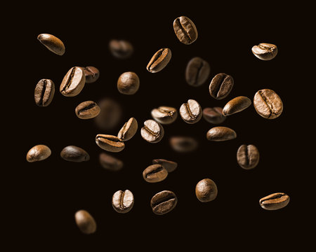 Coffee beans in flight on a dark background © butenkow