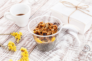 Close up view on vegan granola dessert on white wooden background with espresso cup. vegetarian dessert for breakfast. Healthy food with copy space for design and text.