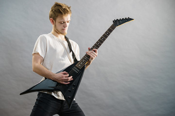 Man playing on electric guitar