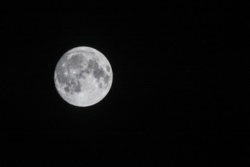 Clear moon in the night above Scoresby Sund, Greenland