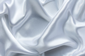 white satin fabric with large folds, delicate background
