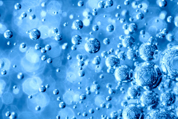 Holidays.Blue shiny Christmas balls snowing.