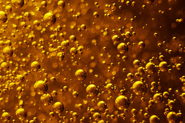 Party mood.Festive golden background with flying shiny bubbles.
