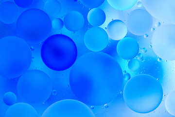 water drops on glass with blue background, close-up 