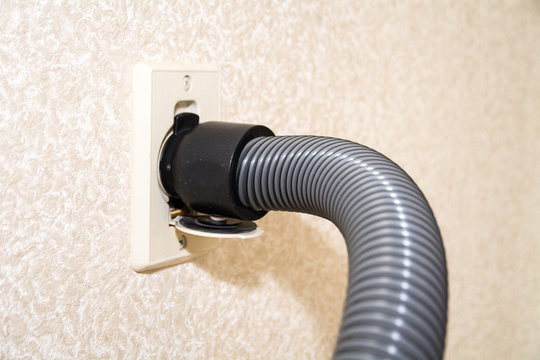 Central Vacuum Cleaner Hose Connected To The Wall