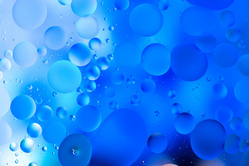 water drops on glass with blue background, close-up 
