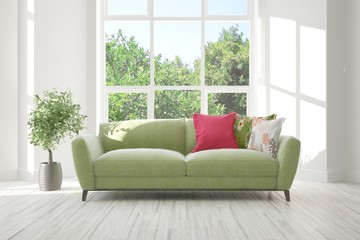 White stylish minimalist room with sofa and summer landscape in window. Scandinavian interior design. 3D illustration