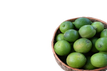 limes in a bowl isolated on white background