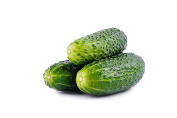 Three green cucumbers isolated on white background.