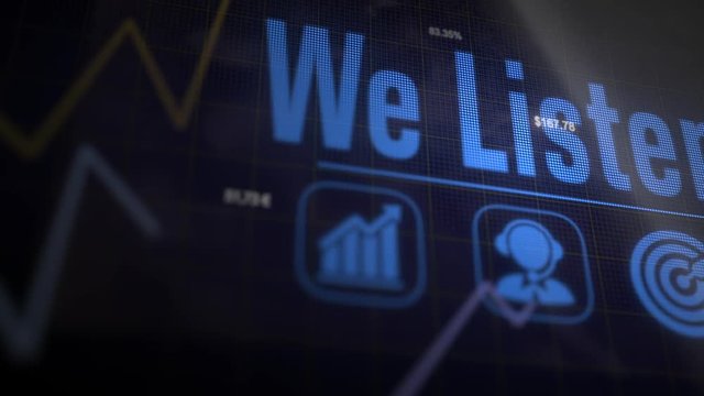 We Listen business concept on a flashing computer monitor with moving graphs and data.