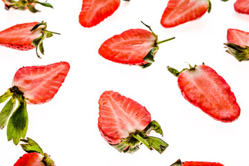 Fresh juicy strawberry pattern. Sliced strawberries isolated on white background.
