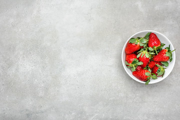 Fresh strawberry on plate, top view