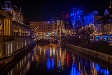 Fototapeta na wymiar LJUBLJANA, SLOVENIA, 2018.12.24: New years decorations in city center at night.