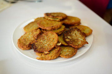 pancakes on a white plate in the kitchen
