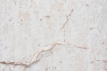 Wall fragment with scratches and cracks