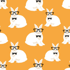 Seamless pattern with white rabbits in glasses on an orange background.