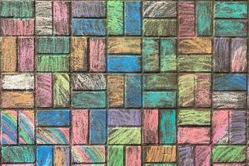 street paving stones painted with chalk, texture for design. street tile decorated with crayons, view from above.
