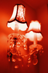 wall sconce with crystal pendants and red lighting