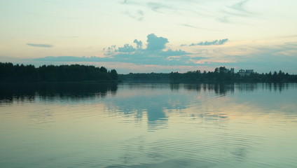 Obraz premium Summer landscape, pond and forest on the horizon.