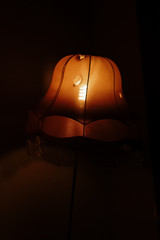 old floor lamp with a hole with a fringe