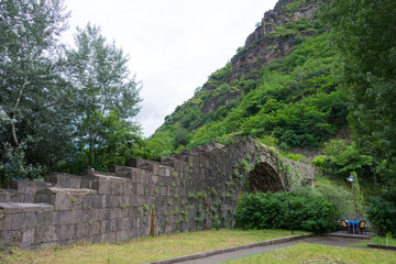 Fototapeta na wymiar Alaverdi, Armenia - Jun 12 2018- Sanahin Bridge. It is build by AD 1195. a famous Historic site in Alaverdi, Lori, Armenia.