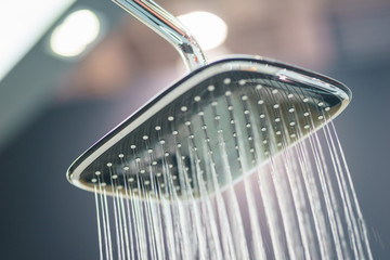 Water pours from the modern shower. Jets of water in the shower close-up. 