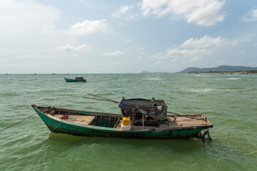 Old worn-out fishing boat on the sea outside Phu Quoc Island, Vietnam.