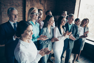Close up side profile view photo different age mixed race business people stand she her he him his together best brigade show appreciation clap hands arms project power formal wear jackets shirts