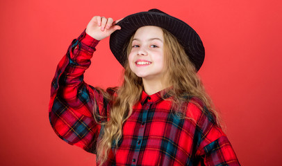 Stylish and confident. Adorable girl wearing fashion hat accessory. Small girl with beauty look. Little girl with long blond hair in fashion style. Cute little fashion model. Fashionable girl child