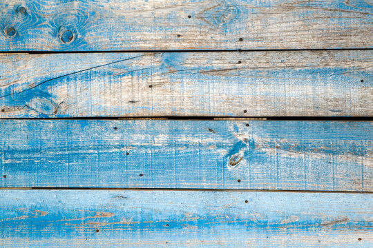 Old blue distressed wooden wall background or texture