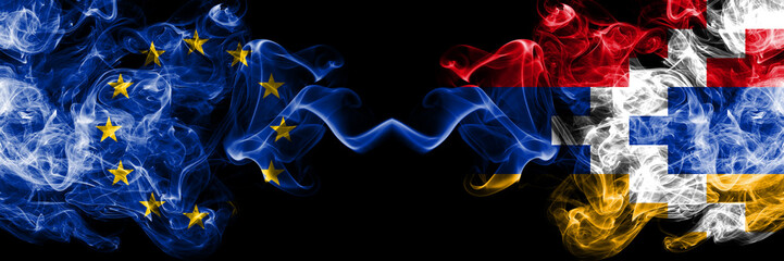 European Union vs Artsakh smoke flags placed side by side. Thick colored silky smoke flags of EU and Artsakh