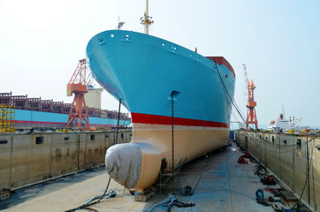 Container ship inside dry dock. 