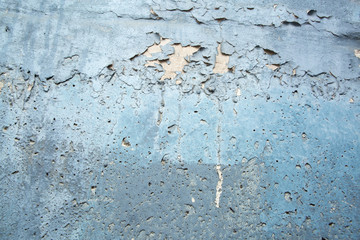 Concrete wall with peeling paint. Color abstract texture.