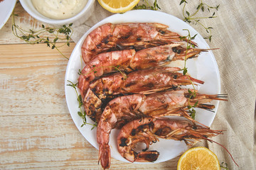Grilled big tiger shrimps prawns on white plate