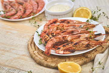 Grilled big tiger shrimps prawns on white plate
