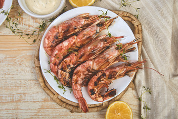 Grilled big tiger shrimps prawns on white plate