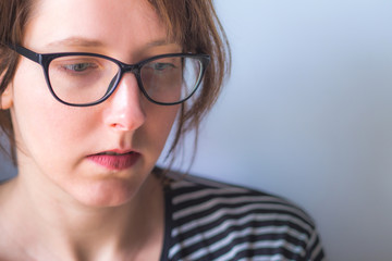 Young woman wearing glasses with copy space