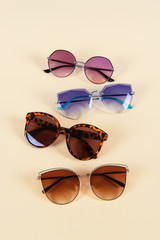 Set of sunglasses on yellow background. Summer concept