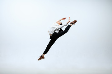 Inspiration of self-development. Happy woman working at office, jumping and dancing in casual...