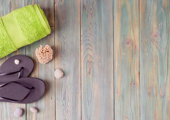 Beach accessories on a wooden background