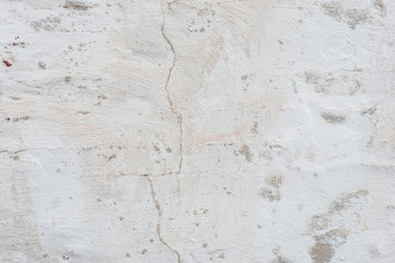Wall fragment with scratches and cracks