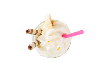 Milkshake with waffle, banan, straw isolated white