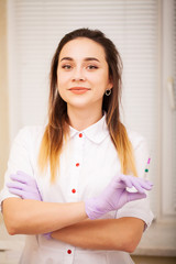 Body Care. Woman doctor displaying machine for laser hair removal