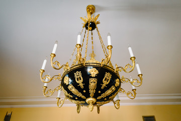 chic antique black and gold chandelier on the ceiling