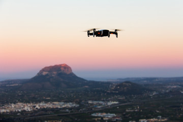 Fototapeta na wymiar A drone flying over a valley in Marina Alta, Alicante. Montgo mountain is in the background