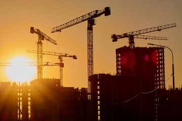 construction of the building cranes in the strongest light, otherwise