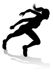 Fototapeta na wymiar Silhouette runner in a race track and field event
