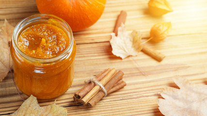 Mashed potatoes or pumpkin jam on a wooden background. Autumn traditional recipe