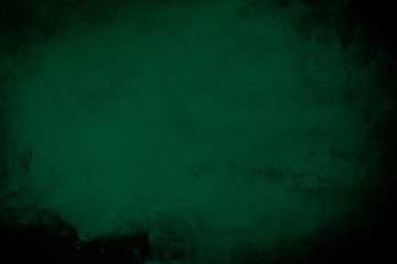 Fototapeta premium Dark green grungy background or texture